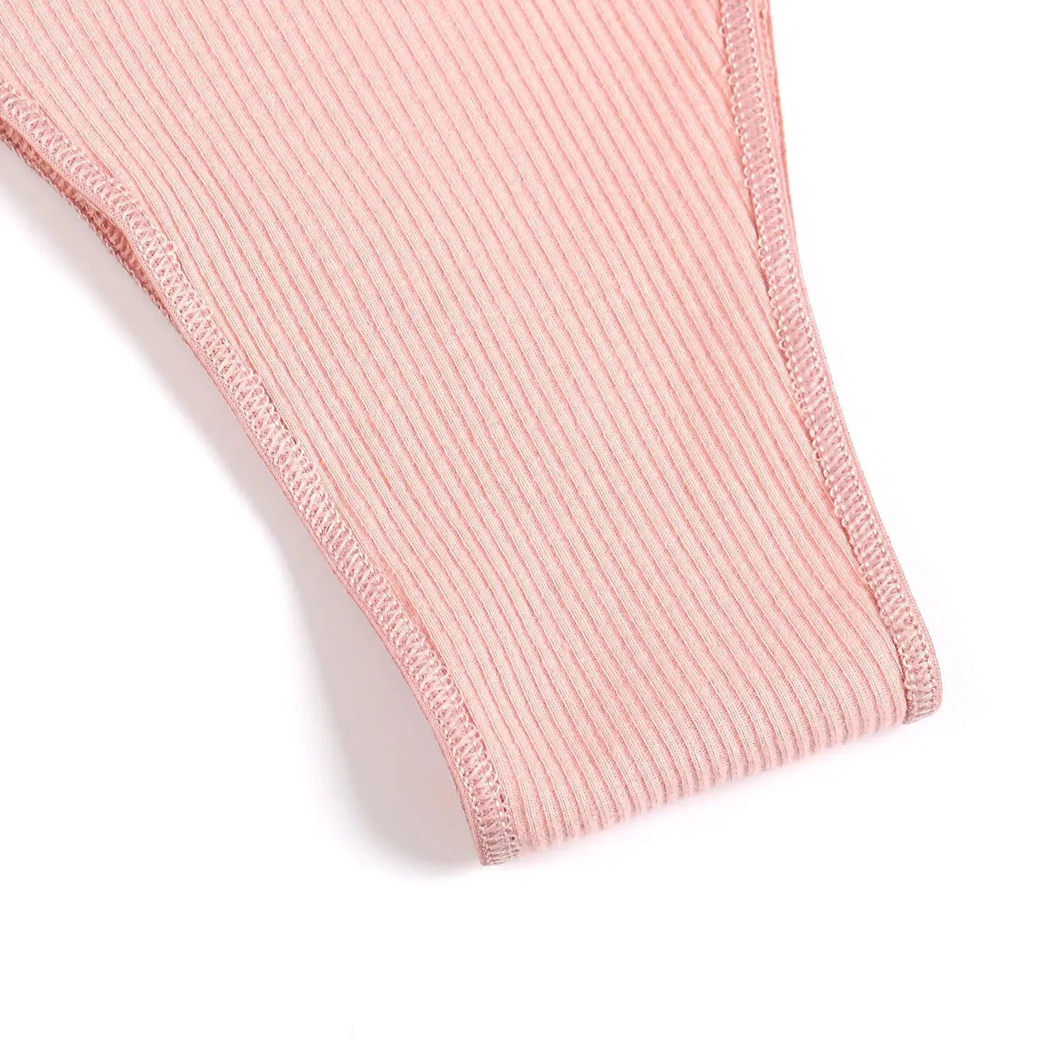Pink ribbed cotton panties for women, low-rise briefs with soft fabric texture.
