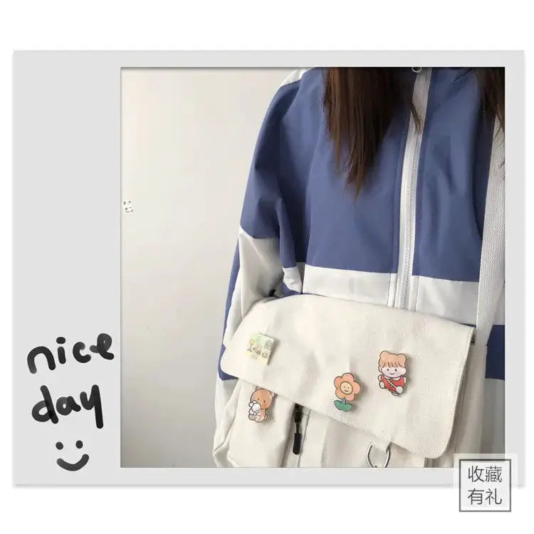Women simple messenger bag by Simples Market in cream canvas with cute cartoon patches and crossbody strap.