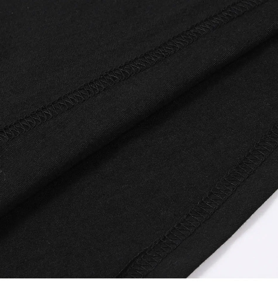 Cotton blouse fabric close-up in black with visible overlock seam stitching