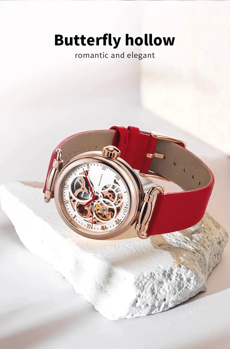 Seagull fashion women's skeleton automatic watch with red leather strap and rose-gold case.