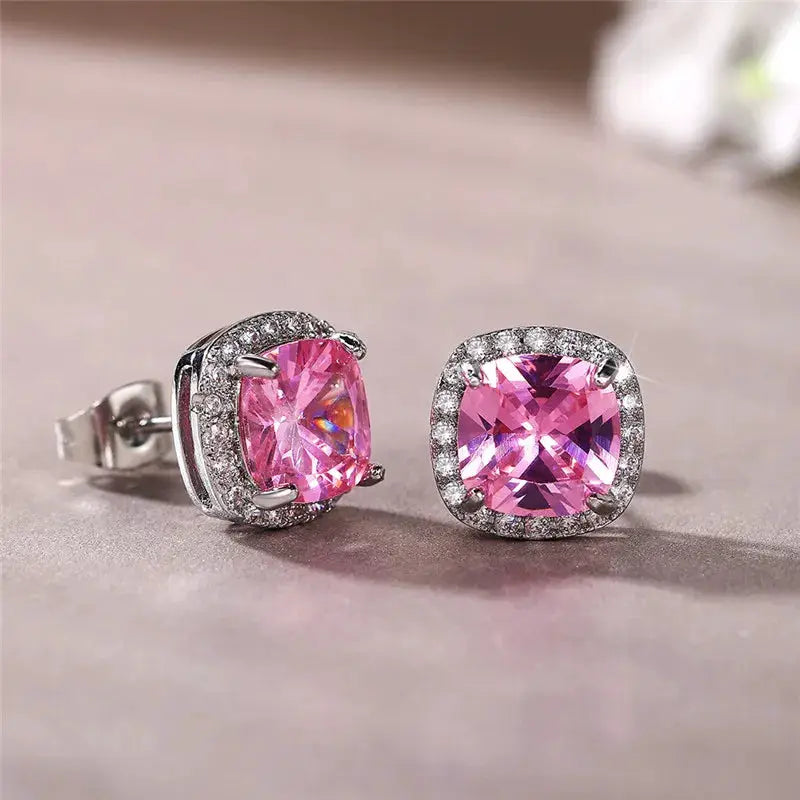 Huitan cushion-cut pink cubic zirconia stud earrings pair with silver halo, luxury jewelry for women.