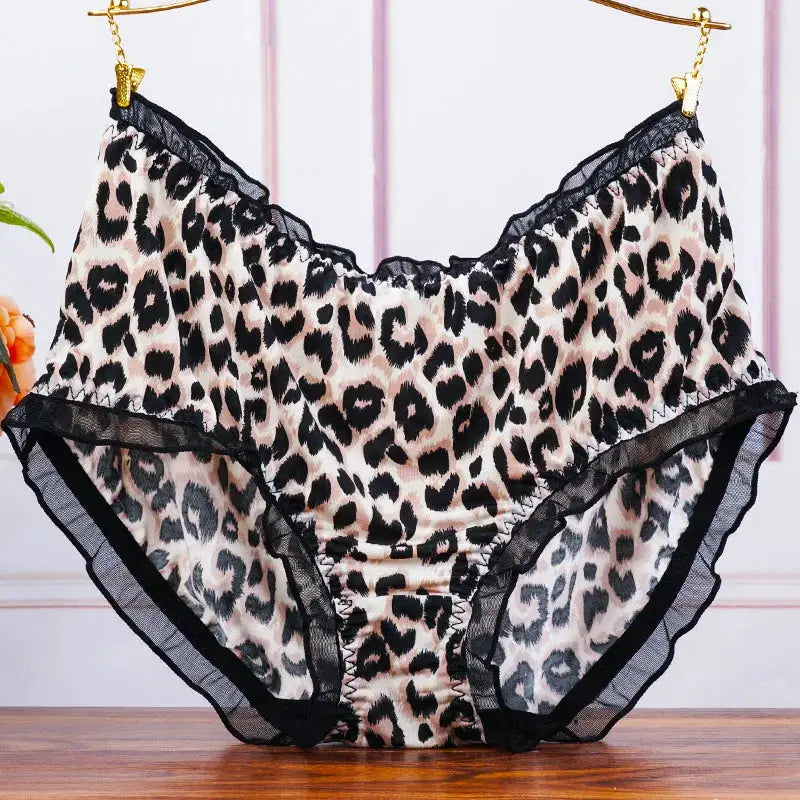 Leopard print mid-waist panties with black lace trim and ruffled edges.
