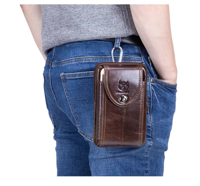 Men's brown leather belt waist bag with front flap and carabiner clip.
