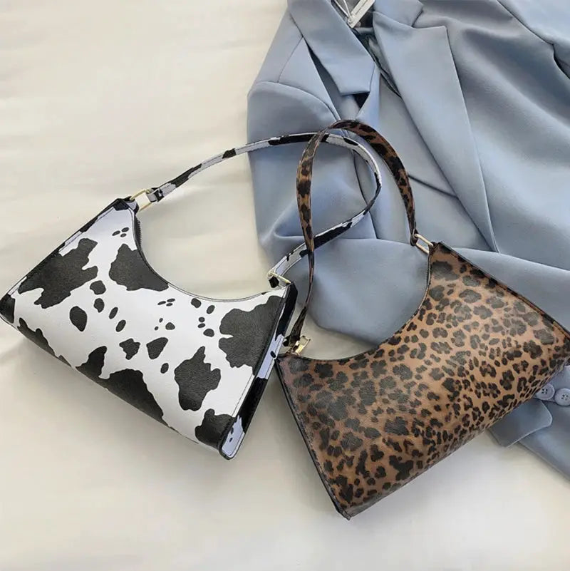 Simples Market two animal-print PU leather shoulder bags with cow and leopard prints and top handles
