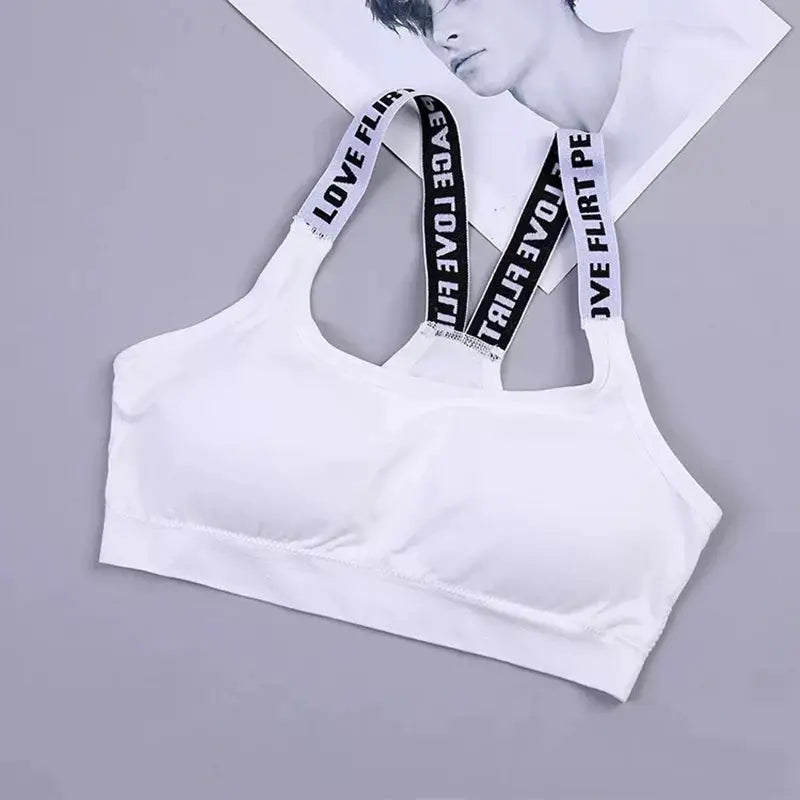 White sports bra top with black elastic straps reading LOVE FLIRT, suitable for gym and yoga