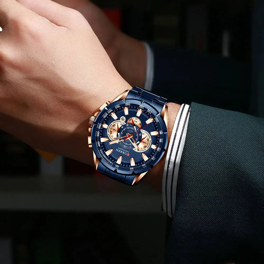 Relógio Curren masculino de aço inox com pulseira azul e mostrador azul com detalhes em ouro rosé, cronógrafo.