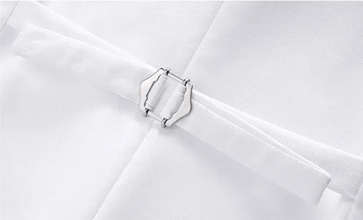 White waistcoat fabric close-up with silver metal buckle detail