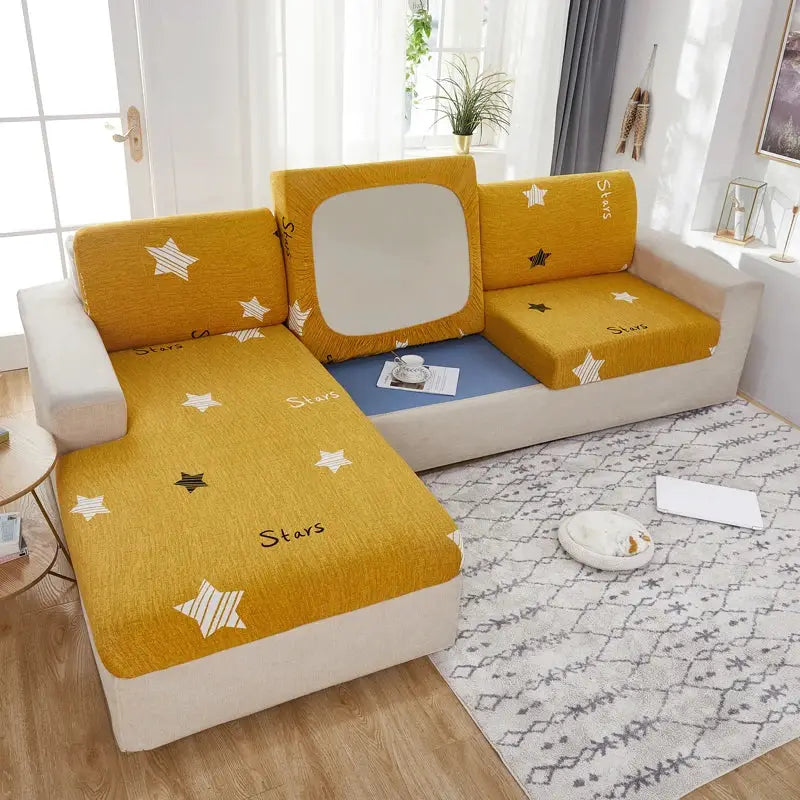 Geometric print furniture protector for corner sofa; mustard yellow stretch slipcover with white stars