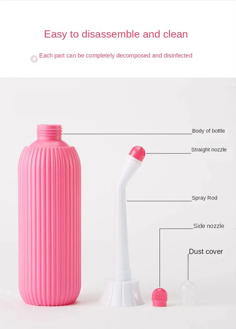 Pink portable bidet set with white curved nozzle and two dust caps; bottle body and spray rod included.