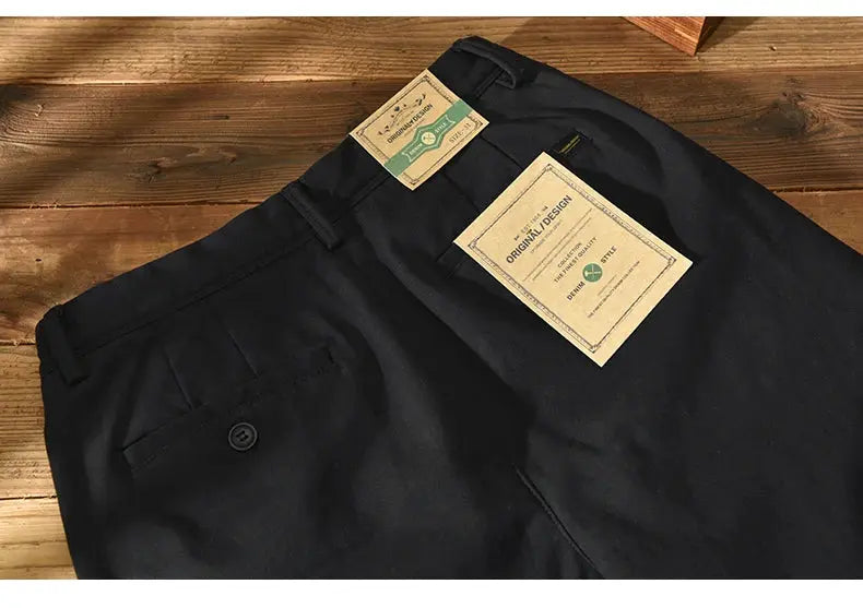 Men's black cotton casual pants with back pocket and button, tags attached