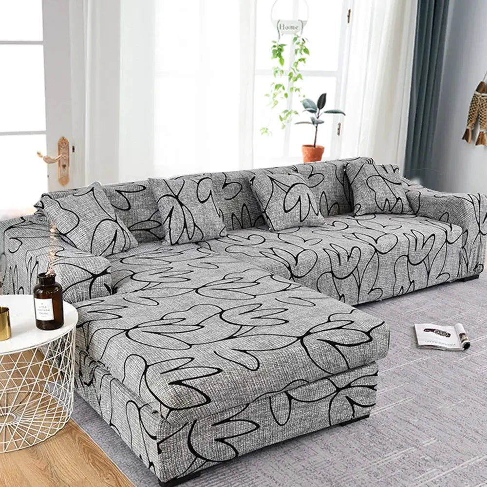 Sofa slipcover for L-shaped corner sofa; grey printed fabric with abstract pattern, elastic stretch fit