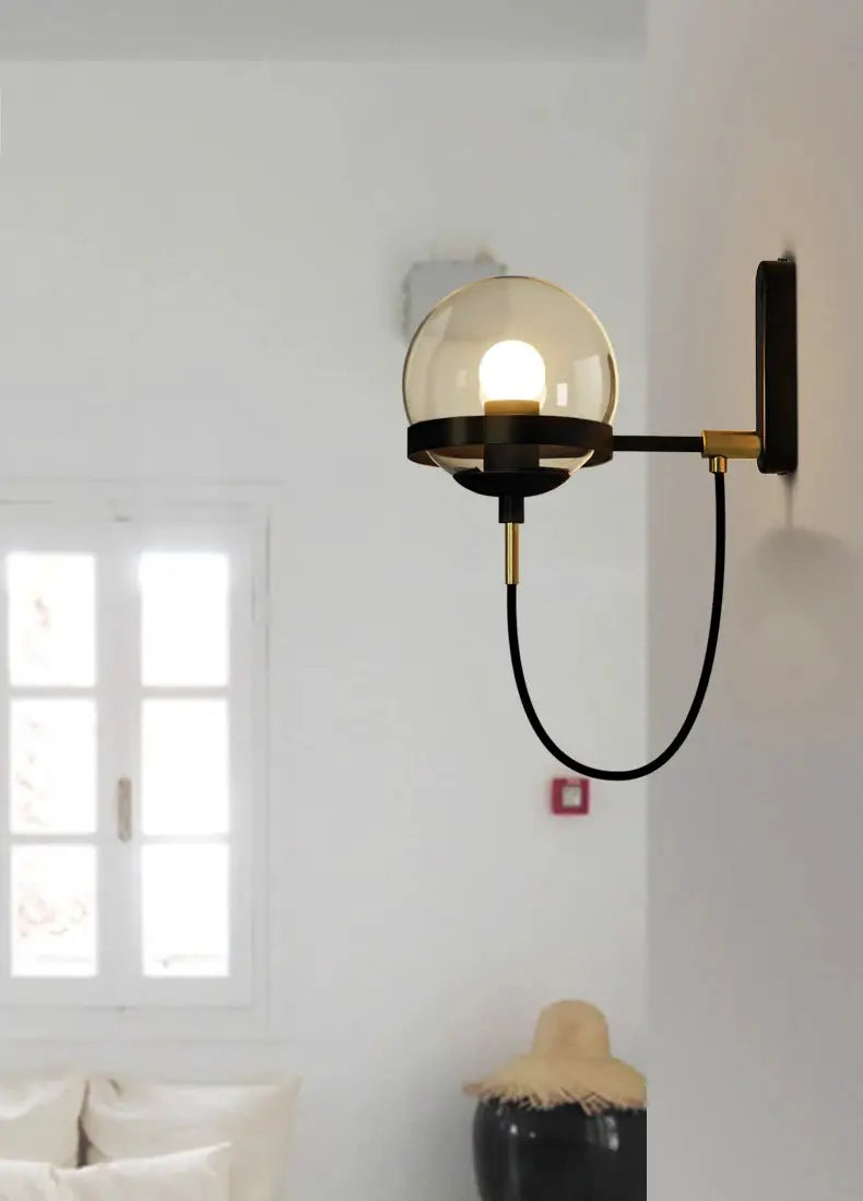 Modern glass ball wall lamp with black metal arm and brass accents, E27, Simples Market