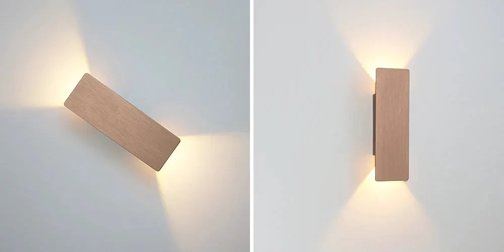 Modern LED indoor wall lamp in brushed aluminum with a wood-toned finish, wall-mounted with warm up/down lighting