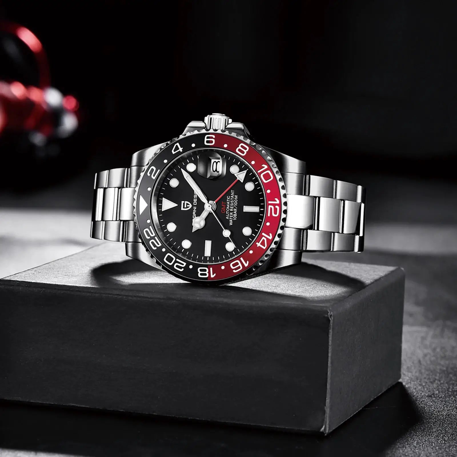 PAGANI DESIGN stainless steel GMT watch with black dial, red and black bezel, and sapphire glass