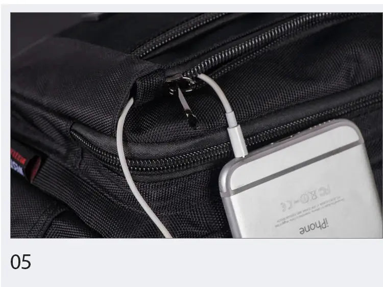 Waist pack black with zippered pockets and a phone-sized device connected by a cable