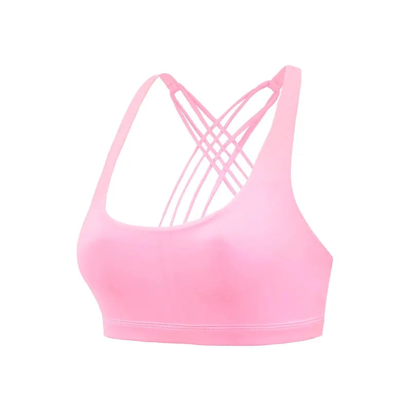 Sports bra by Simples Market, pink color with cross-back strappy design for workouts