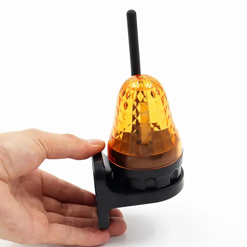 Outdoor LED signal alarm light with orange dome and wall-mount bracket