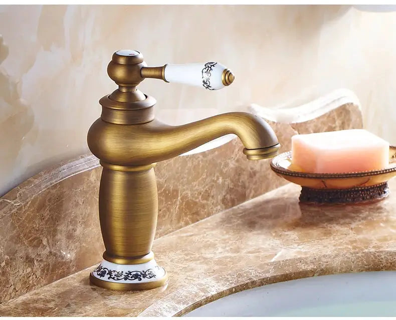 Bathroom faucet ELFCT001 by Simples Market in antique bronze finish; solid brass, white-handled single-handle mixer.