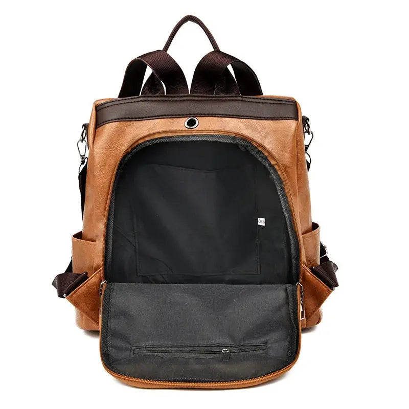 Brown two-tone PU leather anti-theft travel backpack for women with large main compartment and front pocket