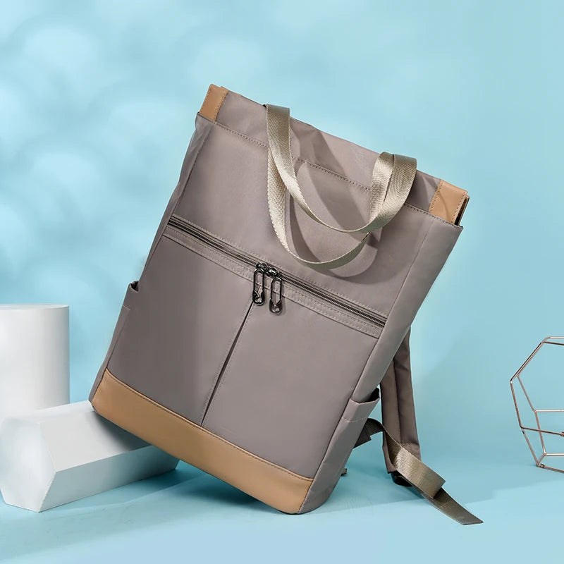 Backpack for women, waterproof Oxford fabric, gray with tan base, front zip pocket