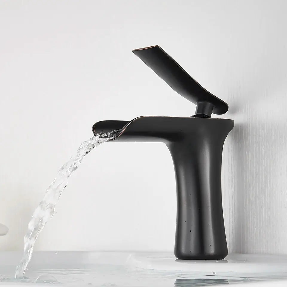 Basin faucet with waterfall spout, single-handle, matte black with copper accent