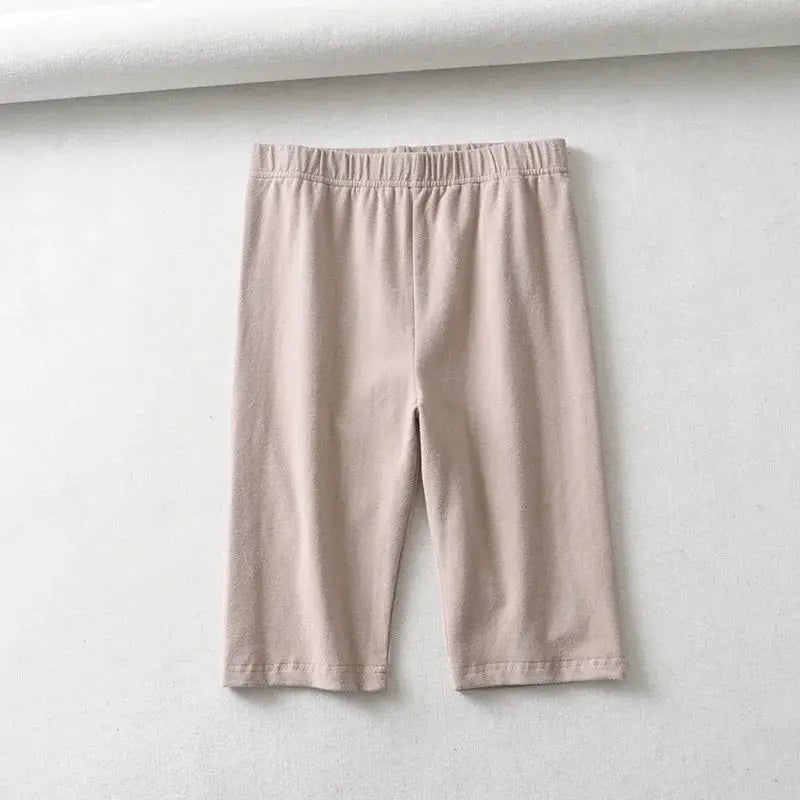 Women's knee-length biker shorts, high-waist elastic waistband in solid beige fabric