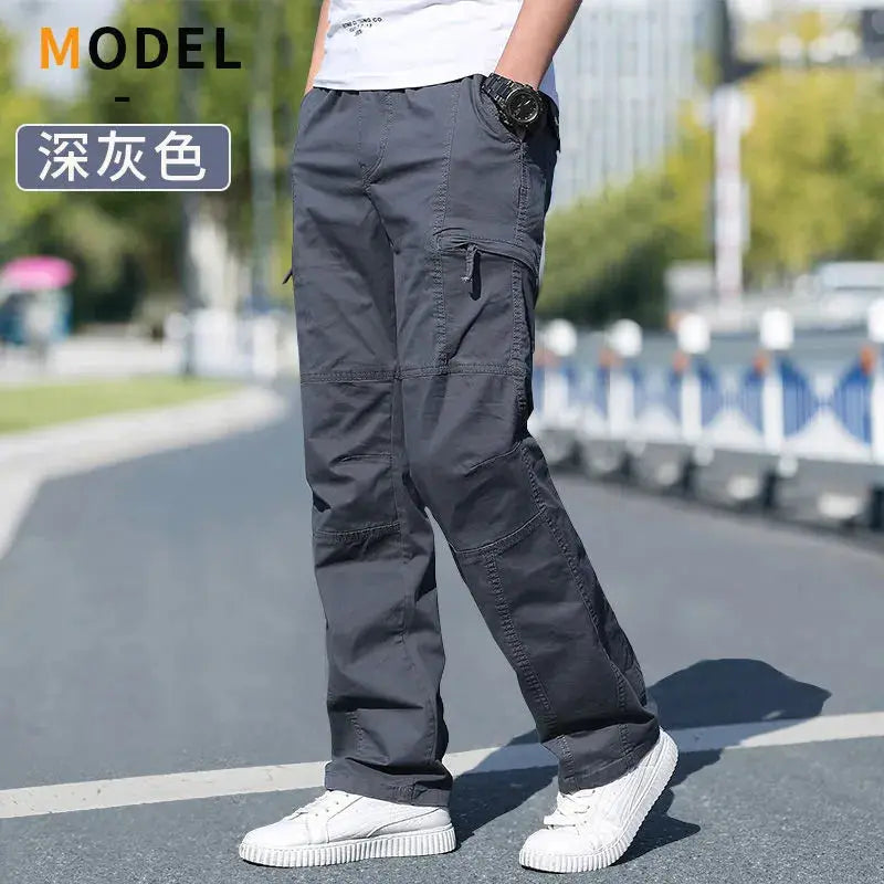 Men's dark gray cargo pants with zip pockets, rugged workwear jogger style.