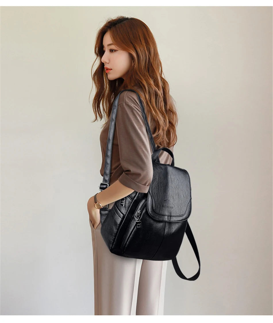 Genuine women's soft black leather backpack with flap and adjustable straps, Simples Market.