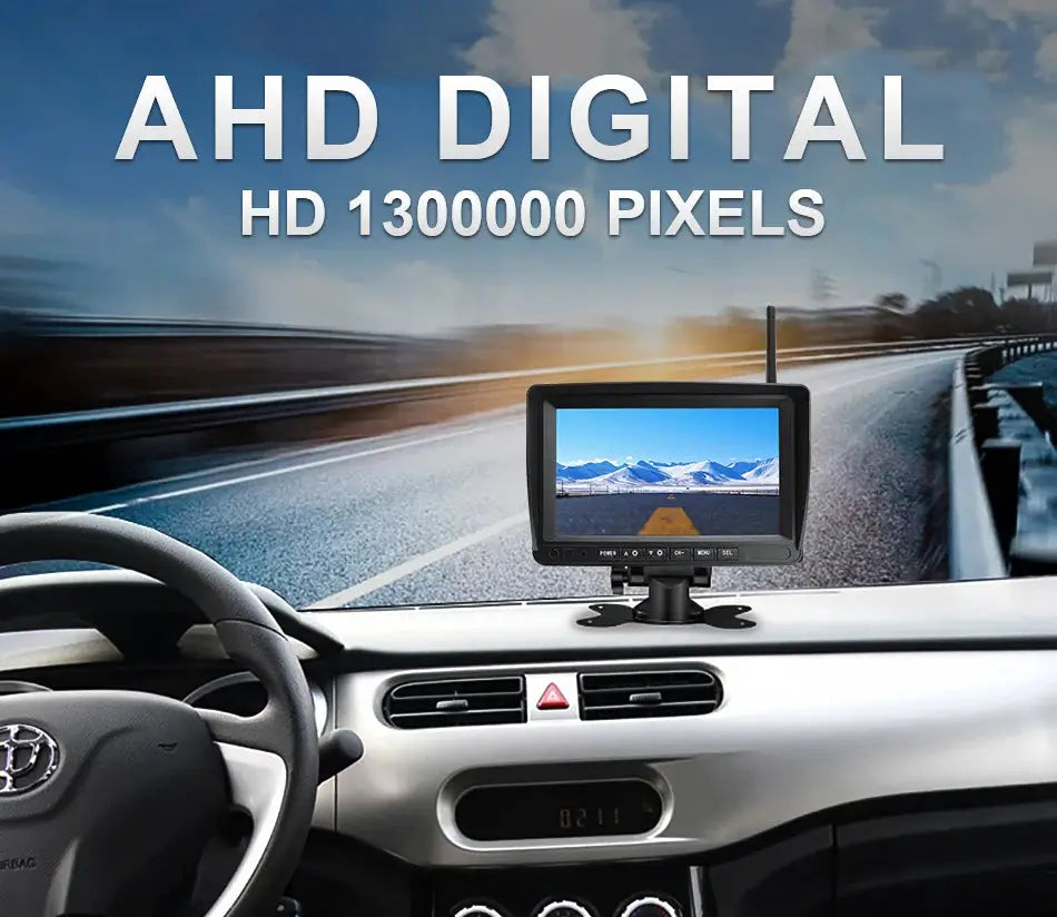 GreenYi 7-inch black AHD wireless DVR monitor mounted on a car dashboard, displaying highway scene.