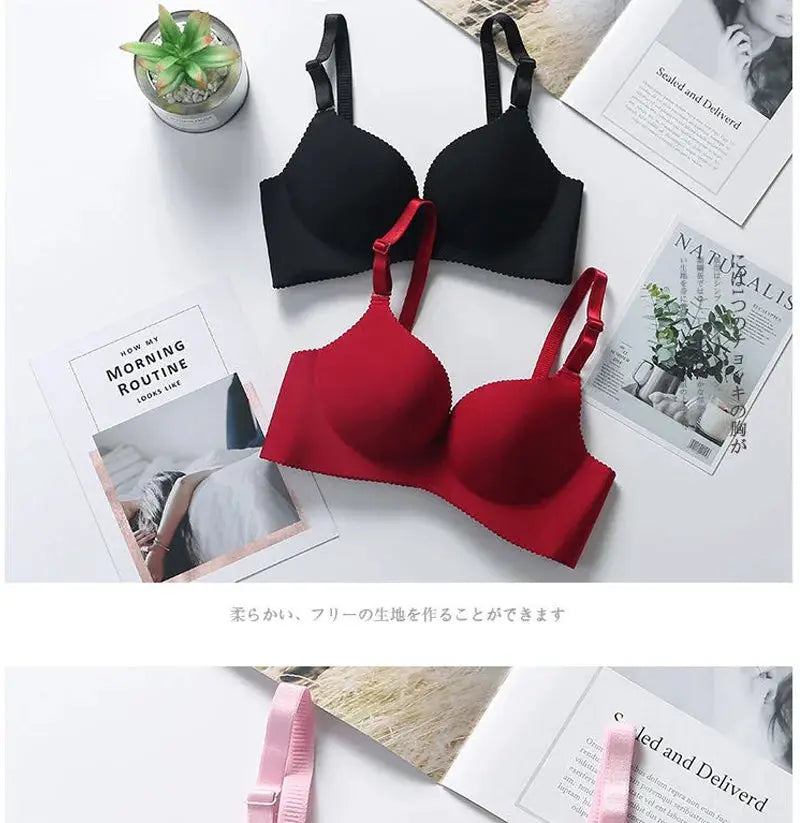 Two wireless seamless plunge bras in black and red with adjustable straps