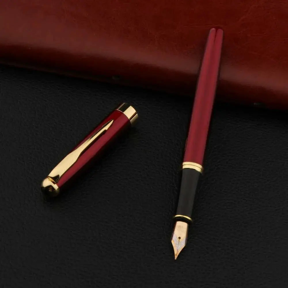 Simples Market two-piece red metal fountain pen with gold trim and nib; cap shown nearby.