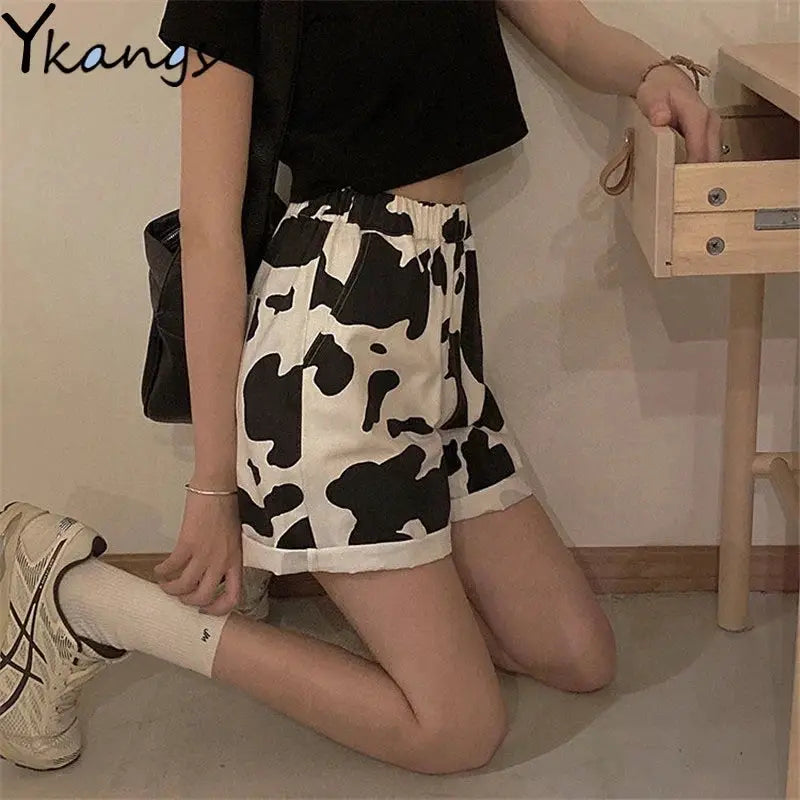 Simples Market women's summer blouse black mid-sleeve top with cow-print shorts; Ykangs logo visible