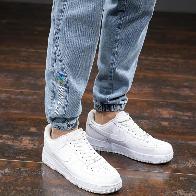 Cargo denim jogger pants for men in light blue with cuffed hems Simples Market