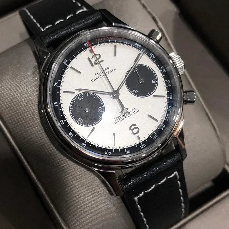 Sugess panda chronograph wristwatch with white dial, black subdials, and leather strap.