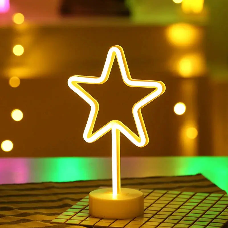 Star-shaped USB LED neon light on a round base with a warm yellow glow