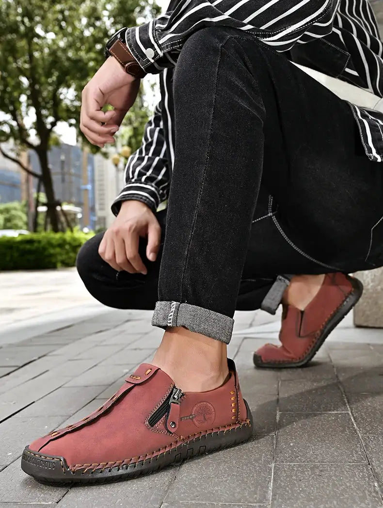 Handmade leather men’s casual slip-on loafers in reddish brown with side zipper and stitched sole