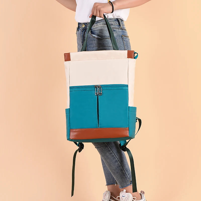 Women’s large waterproof Oxford backpack in teal, cream and brown with front zip pocket