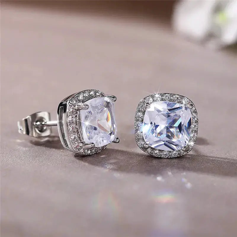 Pair of Huitan cushion-cut cubic zirconia stud earrings in silver with a halo of clear stones