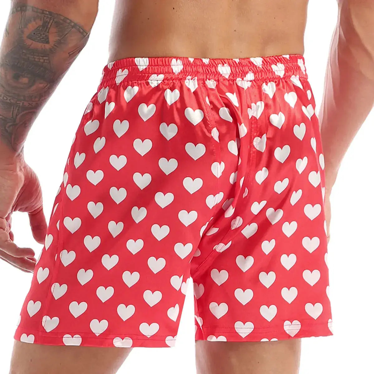 Men's red heart-print boxer shorts with white hearts and an elastic waistband.