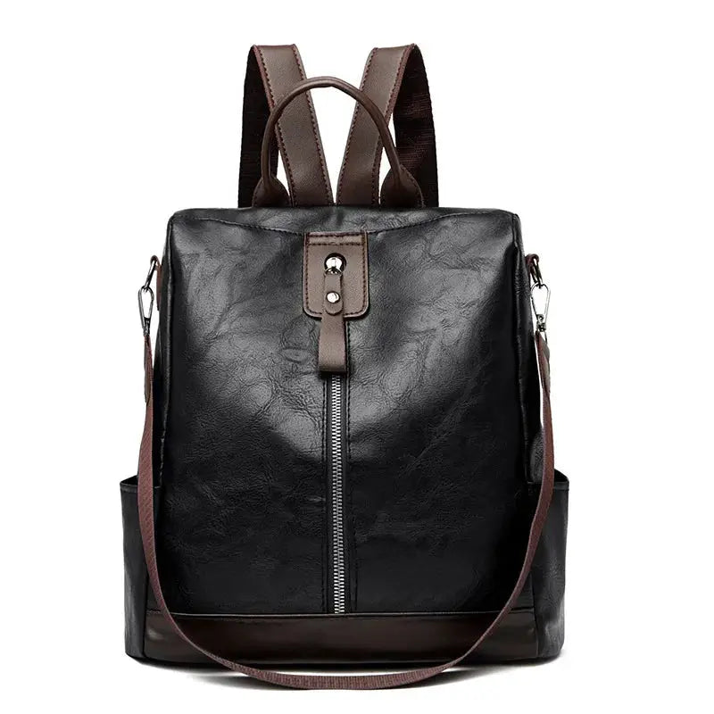 Women’s anti-theft backpack, black PU leather with brown trim and adjustable shoulder strap