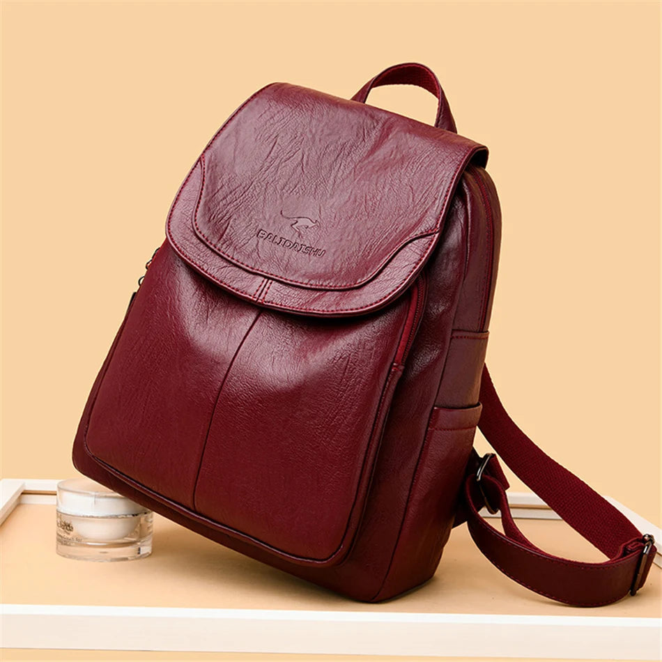 Simples Market genuine leather backpack for women in burgundy with top flap and adjustable shoulder straps