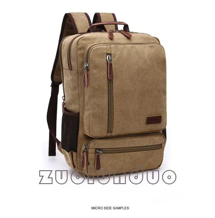 Vintage tan canvas backpack with multiple zip pockets, leather pull tabs, and a side mesh pocket