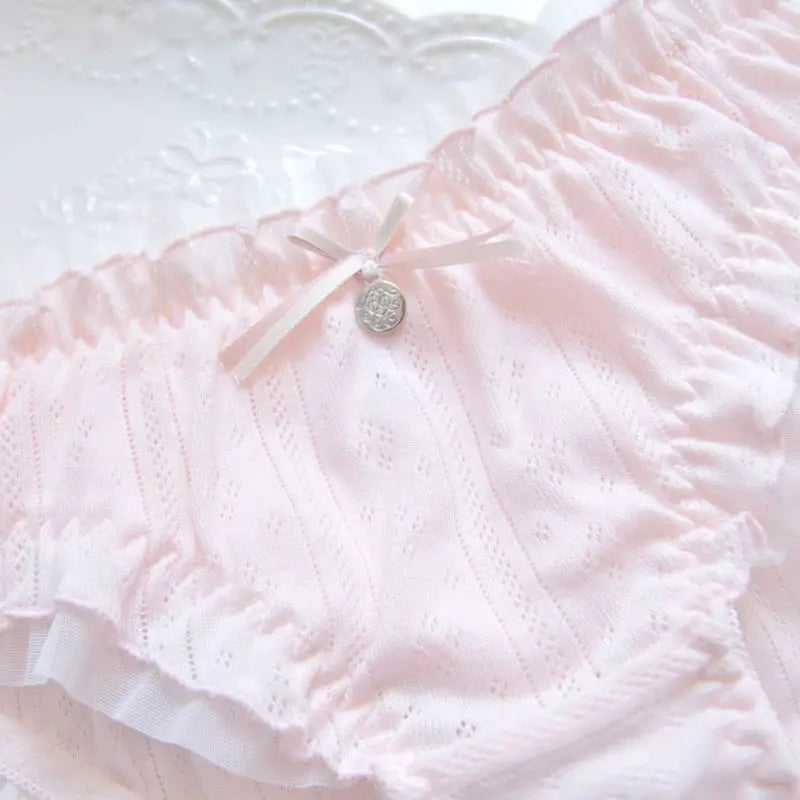 Pink lace panties with ruffle trim and bow charm, breathable high-elasticity underwear.