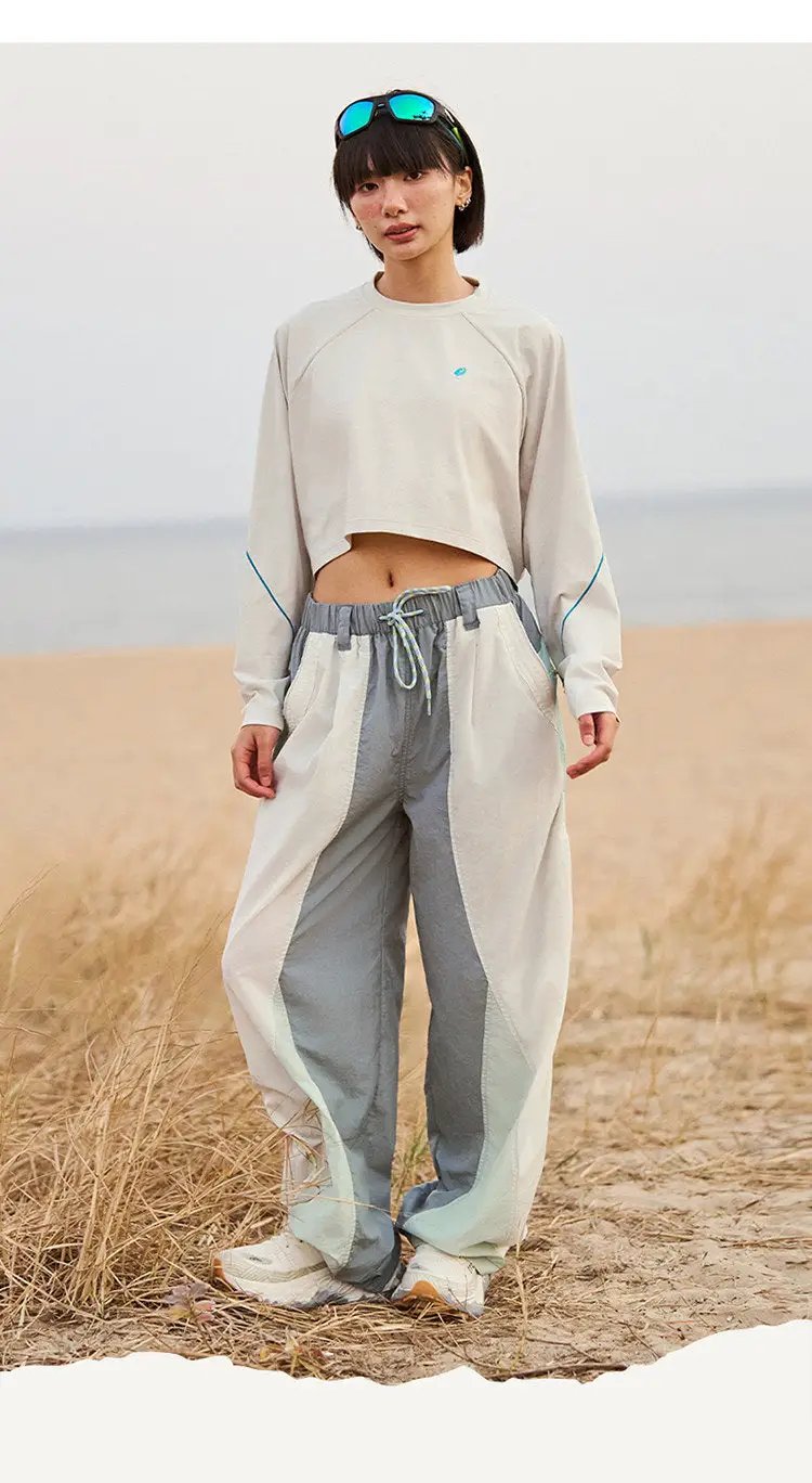 Techwear cargo pants by Simples Market in cream-gray color-block with drawstring waist