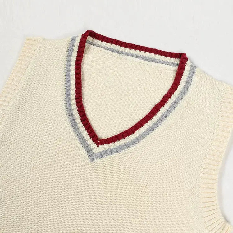 Sweater vest Simples Market cream knitted men's sleeveless with V-neck and red/gray striped trim.