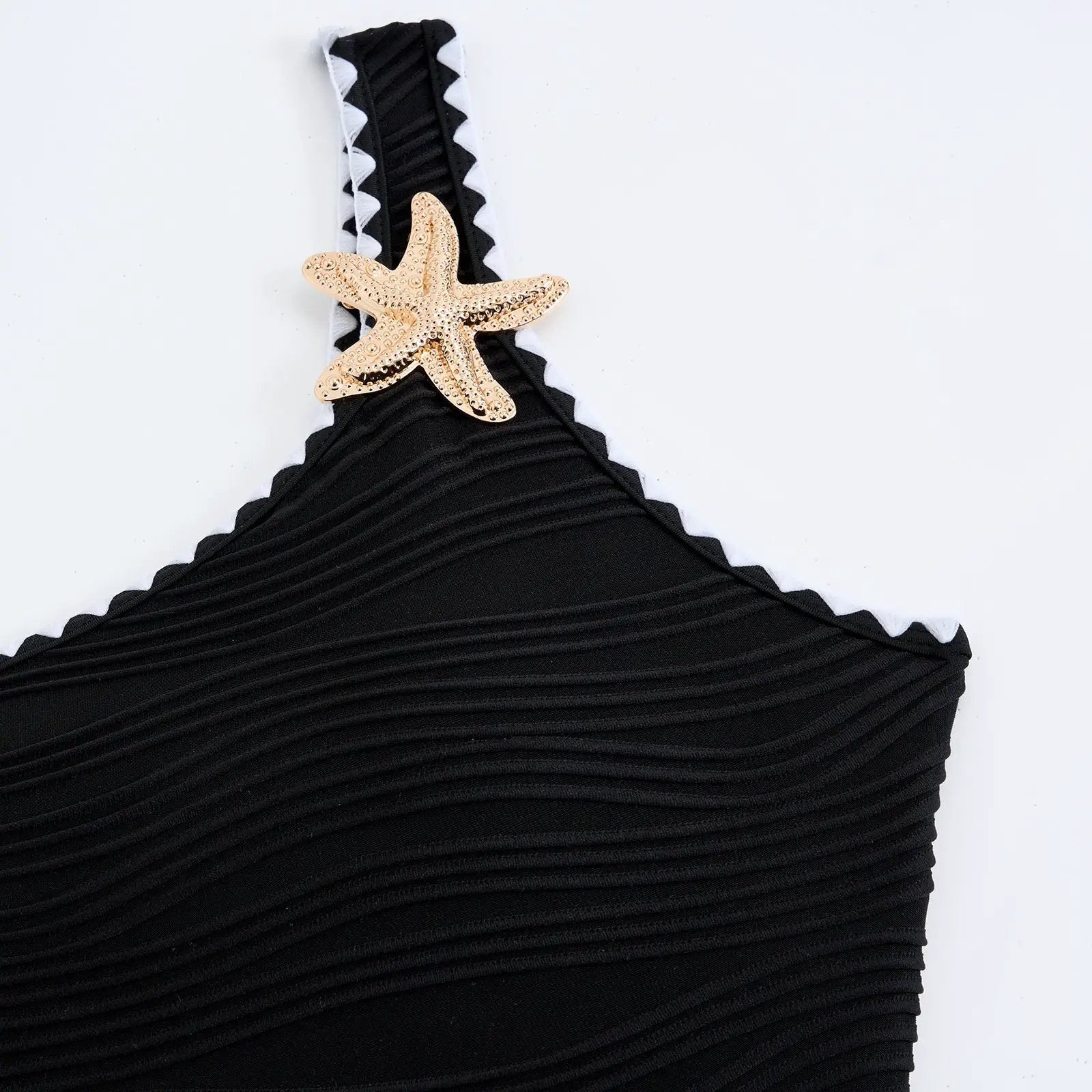 Black textured strapless bikini top with white zigzag trim and gold starfish charm