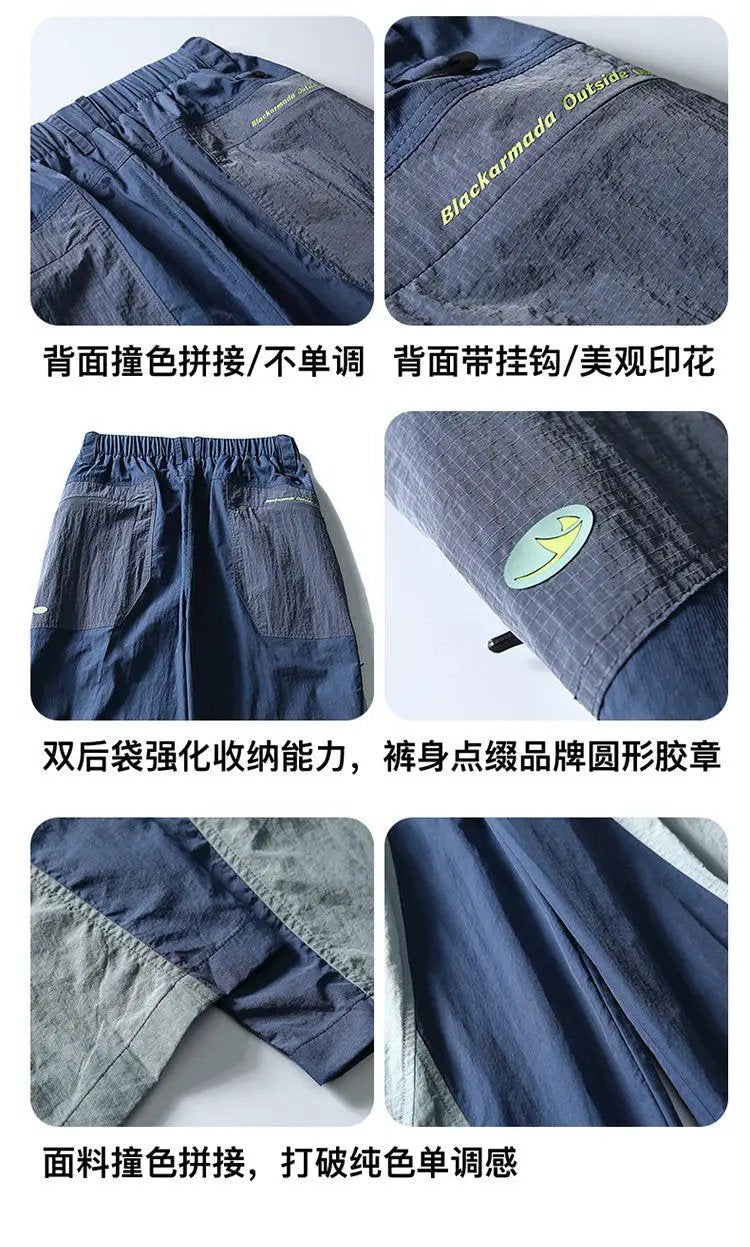 Cargo pants by Simples Market, navy blue lightweight quick-dry track pants with color-block panels and cargo pockets.