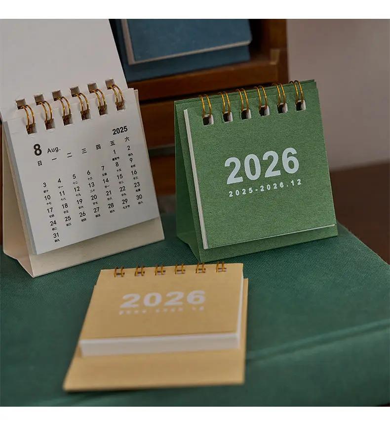 Mini desk calendar set by Simples Market; three coil-bound calendars in green, white, and kraft for desk decor.