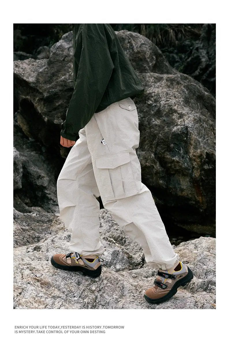 Ultra Loose Lightweight Outdoor Cargo Pants in beige with large side cargo pockets and wide legs.