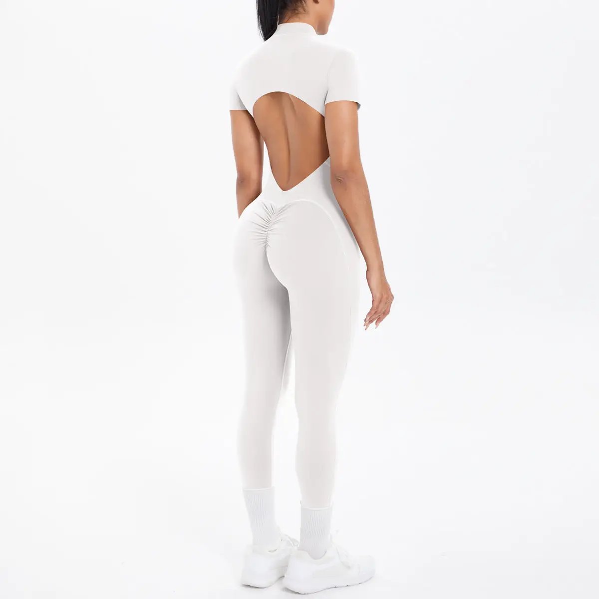White backless bodycon scrunch jumpsuit by Simples Market, open back cutout for dance/fitness.